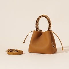 ivory pebbled leather bucket bag with braided top handle – CALISTA