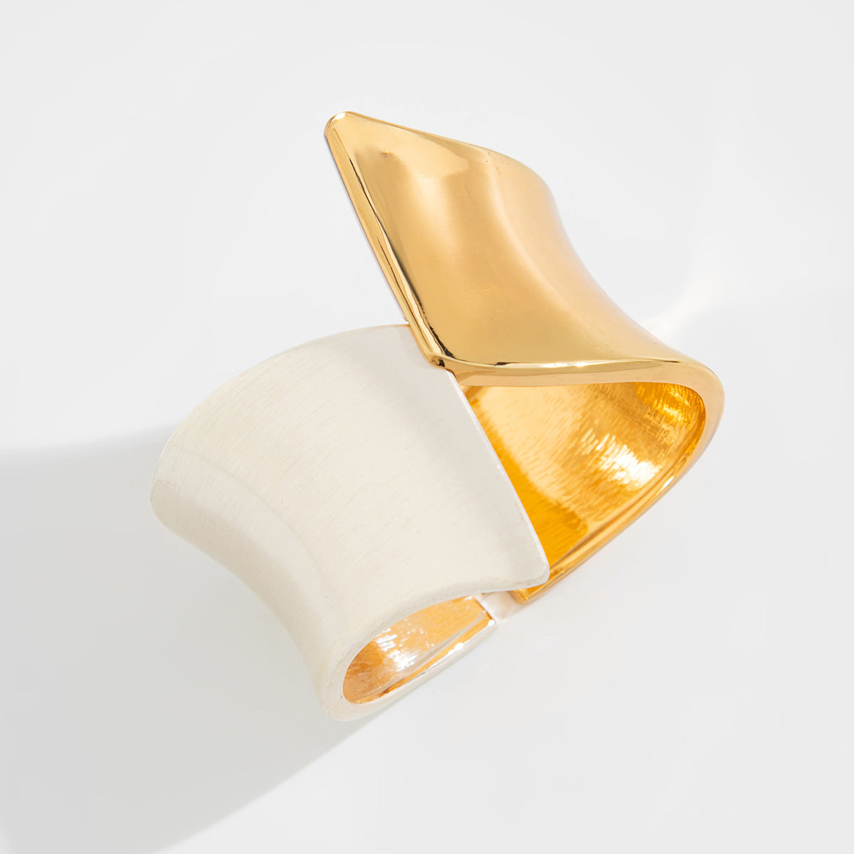 Two-tone wide cuff bracelet with sculptural twist - Nesdu