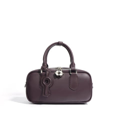 structured mini tote with key charm and top handles – NOLAR