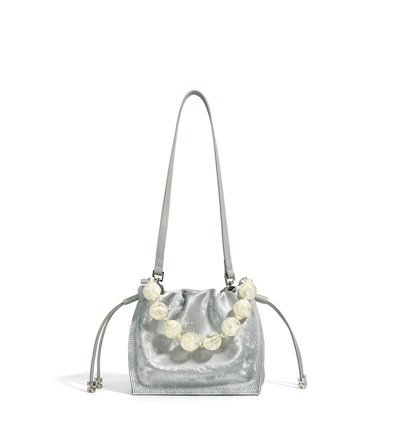 metallic drawstring shoulder bag with pearl handle – OLIVE