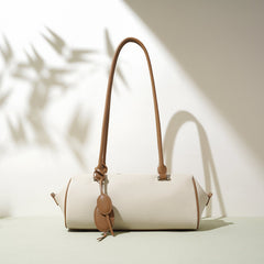barrel-shaped shoulder bag with twin charm detail – LILURA