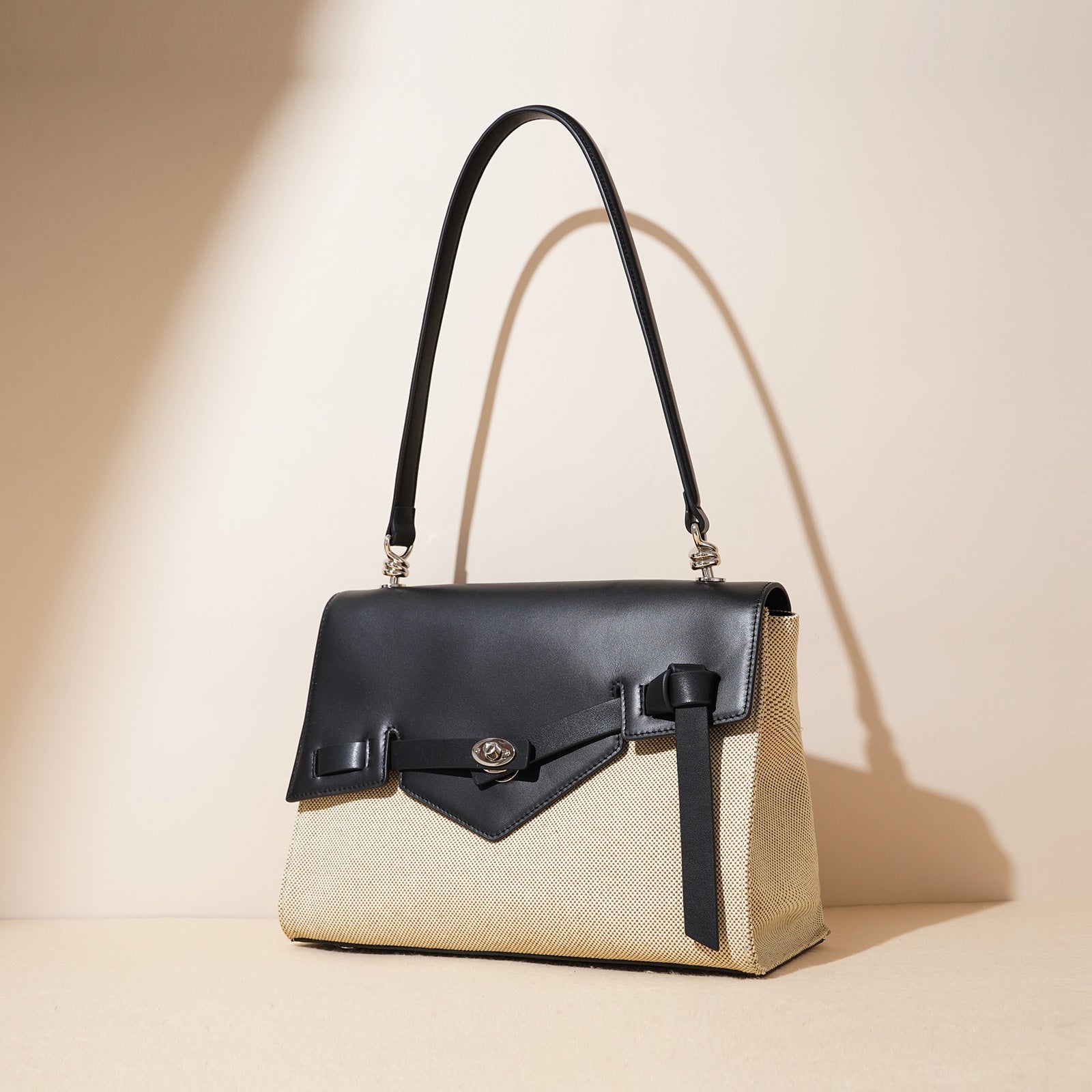 contrast flap structured handbag with knot detail – NEVAL