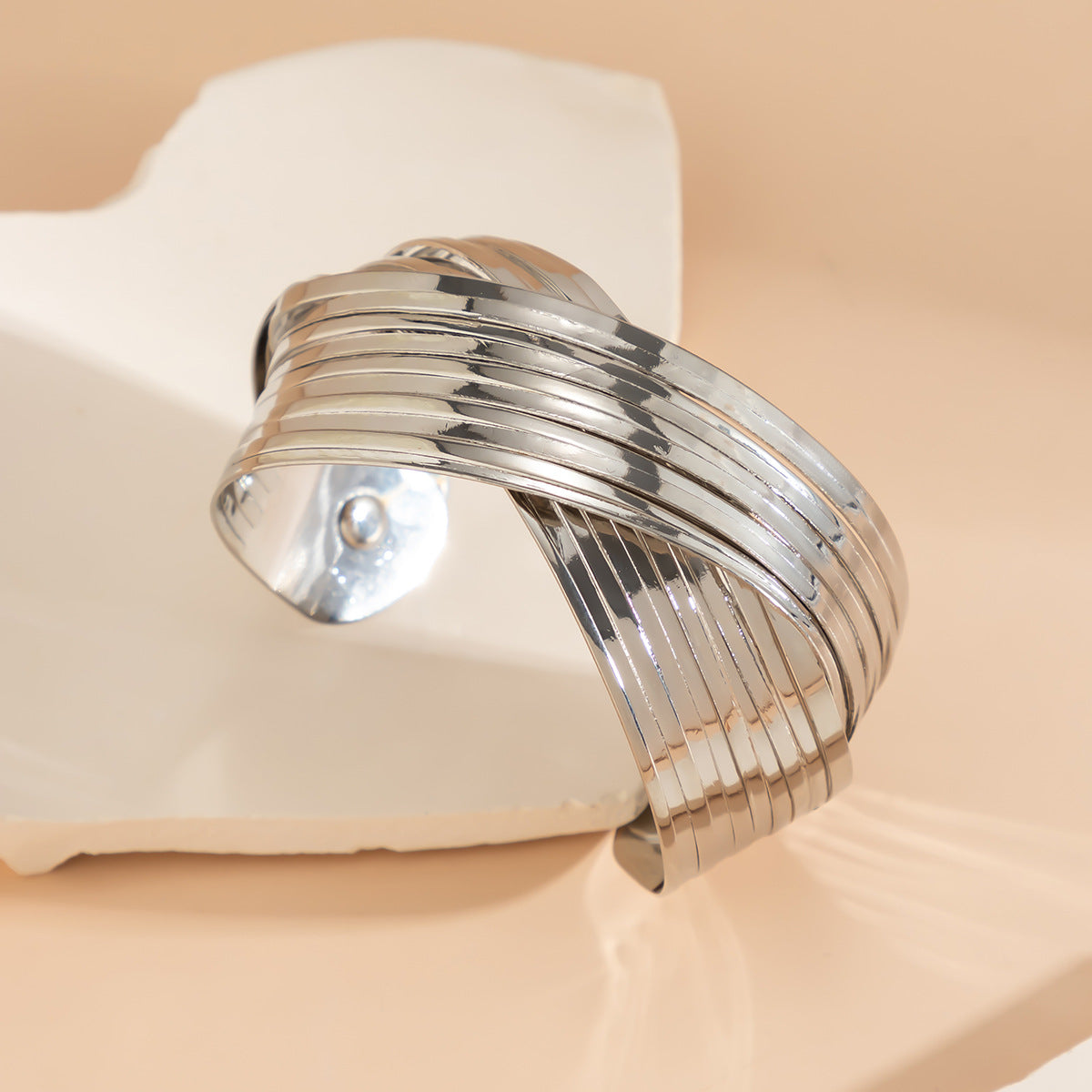 layered gold cuff bracelet with twisted band design – SEREIA