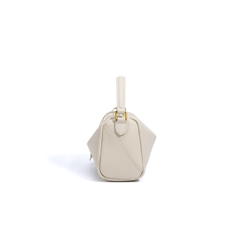curved shoulder bag with contrast charm detail – MIIRA