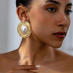 Textured oval stud earrings with pearl center – Lairi