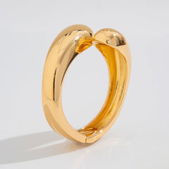 sculpted gold cuff bracelet with fluid twist – ARYIY