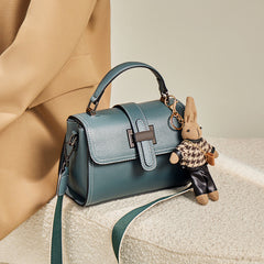 boxy leather handbag with buckle strap & bunny charm – TEAL