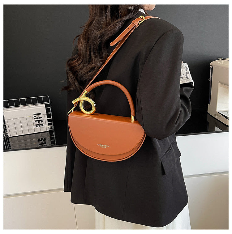 half-moon leather handbag with gold spiral handle – ORENA
