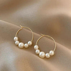 gold hoop earrings with graduated pearls – SENA
