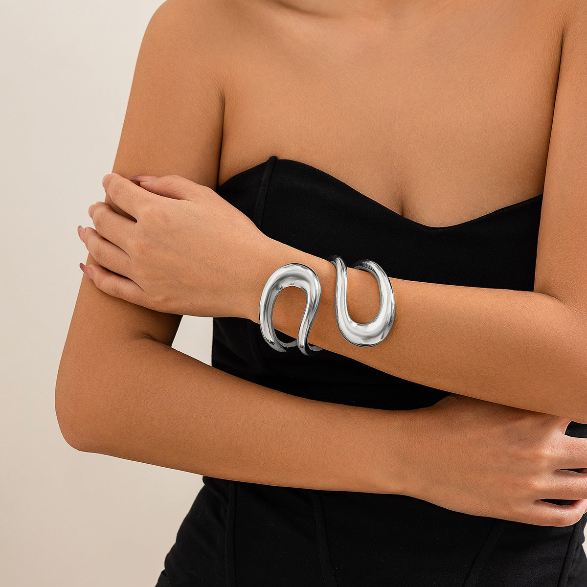 Abstract wave-shaped open cuff bracelet with polished finish – Akjy