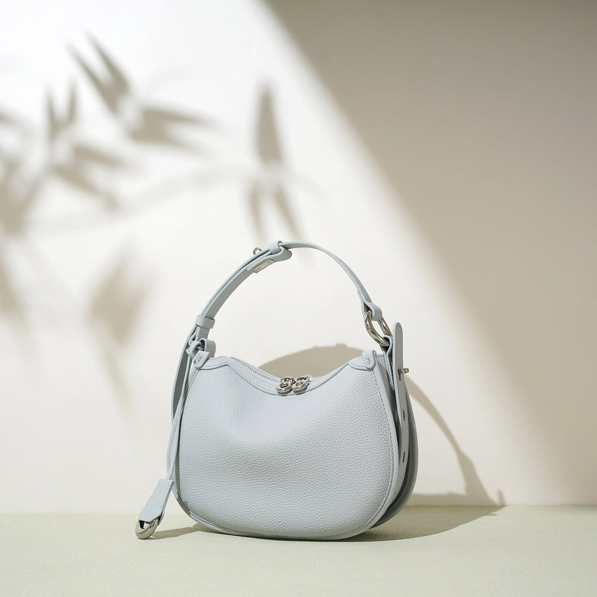 textured leather crescent bag with top handle - LAYLONA