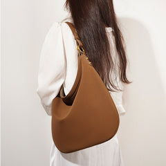 curved hobo shoulder bag with gold hardware - AXYA
