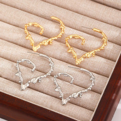 Molten heart-shaped hoop earrings with sculpted texture - Lamno