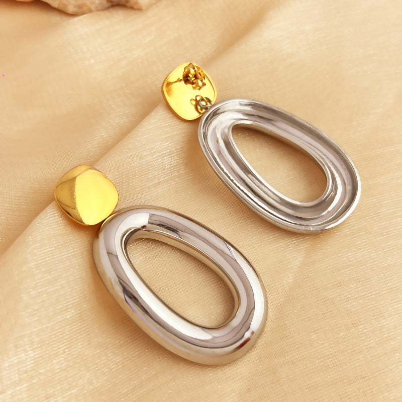 Two-tone geometric drop earrings with open oval detail – Nisdy