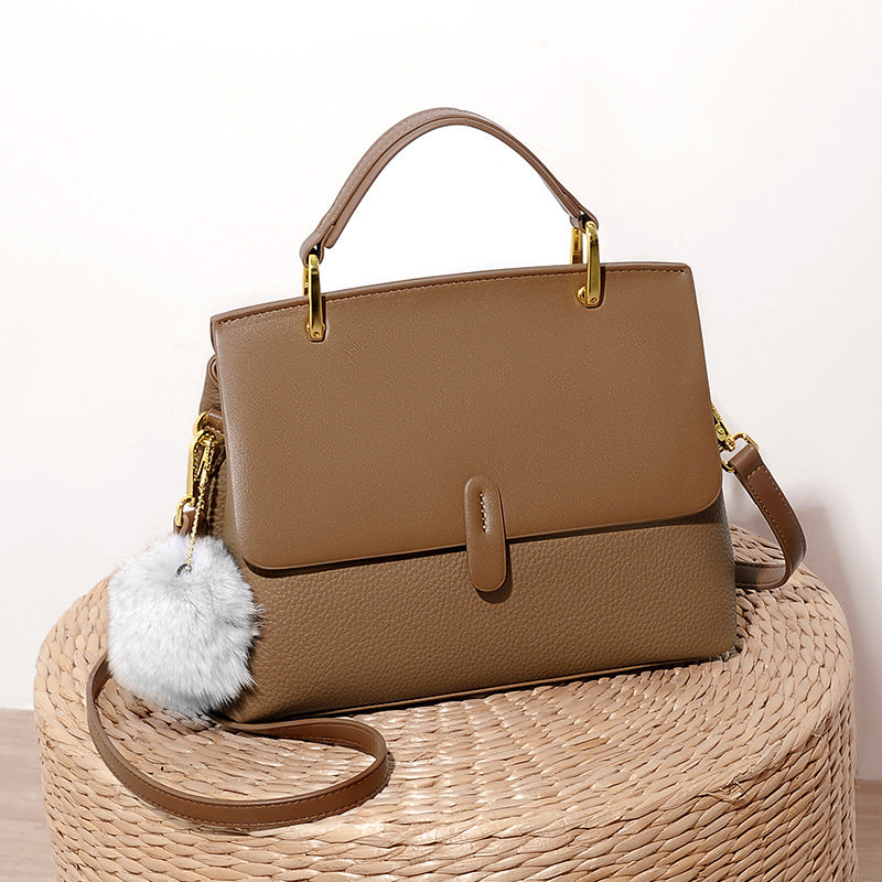 Structured handbag with gold hardware and pompom accent - Lilsy
