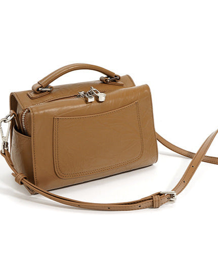 structured trapeze handbag with front patch pocket - NOXIR