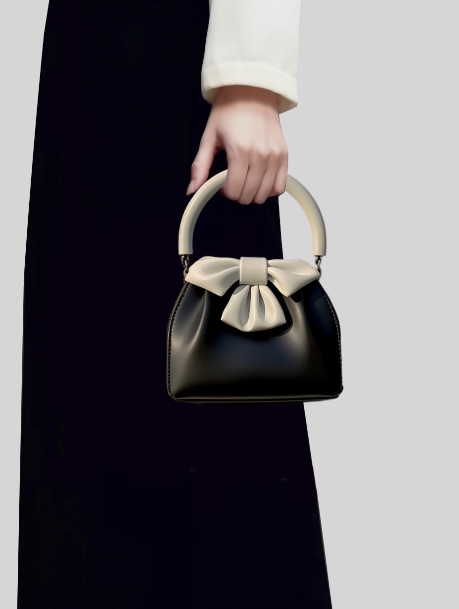 Bow-embellished handbag with round handle - Sikry
