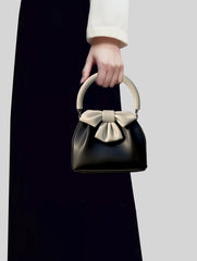 Bow-embellished handbag with round handle - Sikry