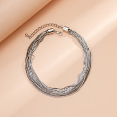 Multi-strand chain necklace with textured layers - Nimlu