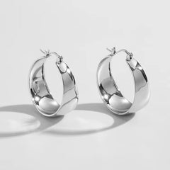 wide sculpted hoop earrings with polished finish - Solan