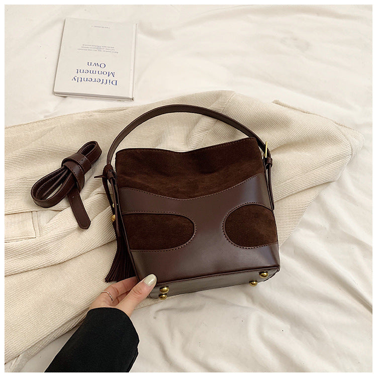 suede bucket bag with curved leather trim – RUBY