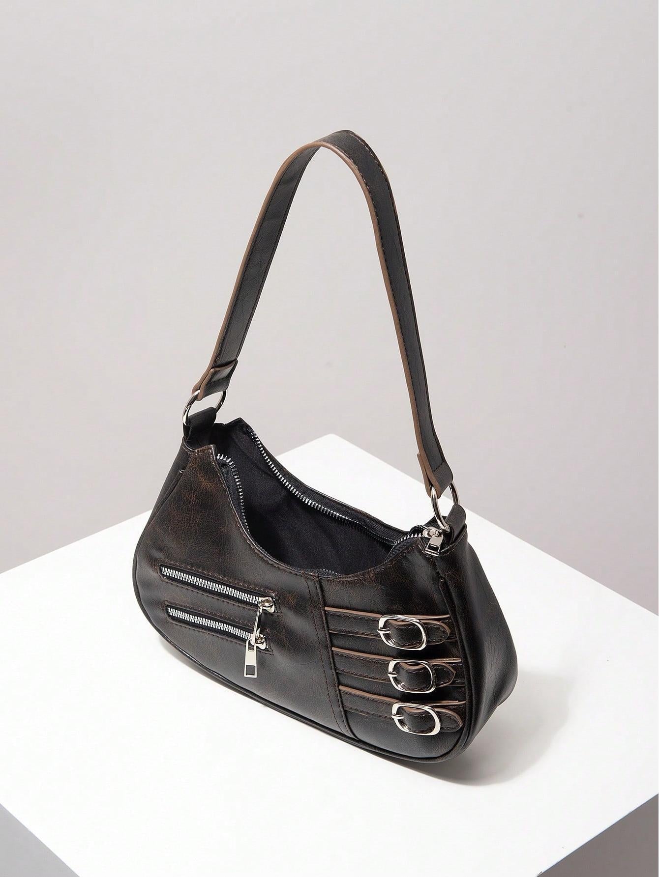 Crescent shoulder bag with buckle and zipper detail - Rimna