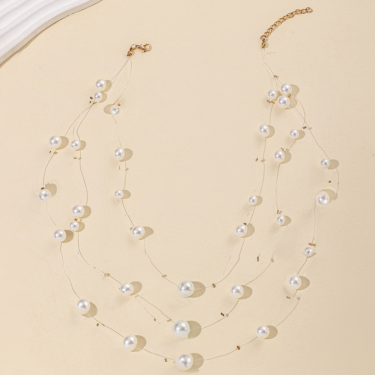 floating pearl strand necklace with layered illusion threads – AUIRO