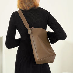 tall leather bucket bag with circular tab – OLIVE