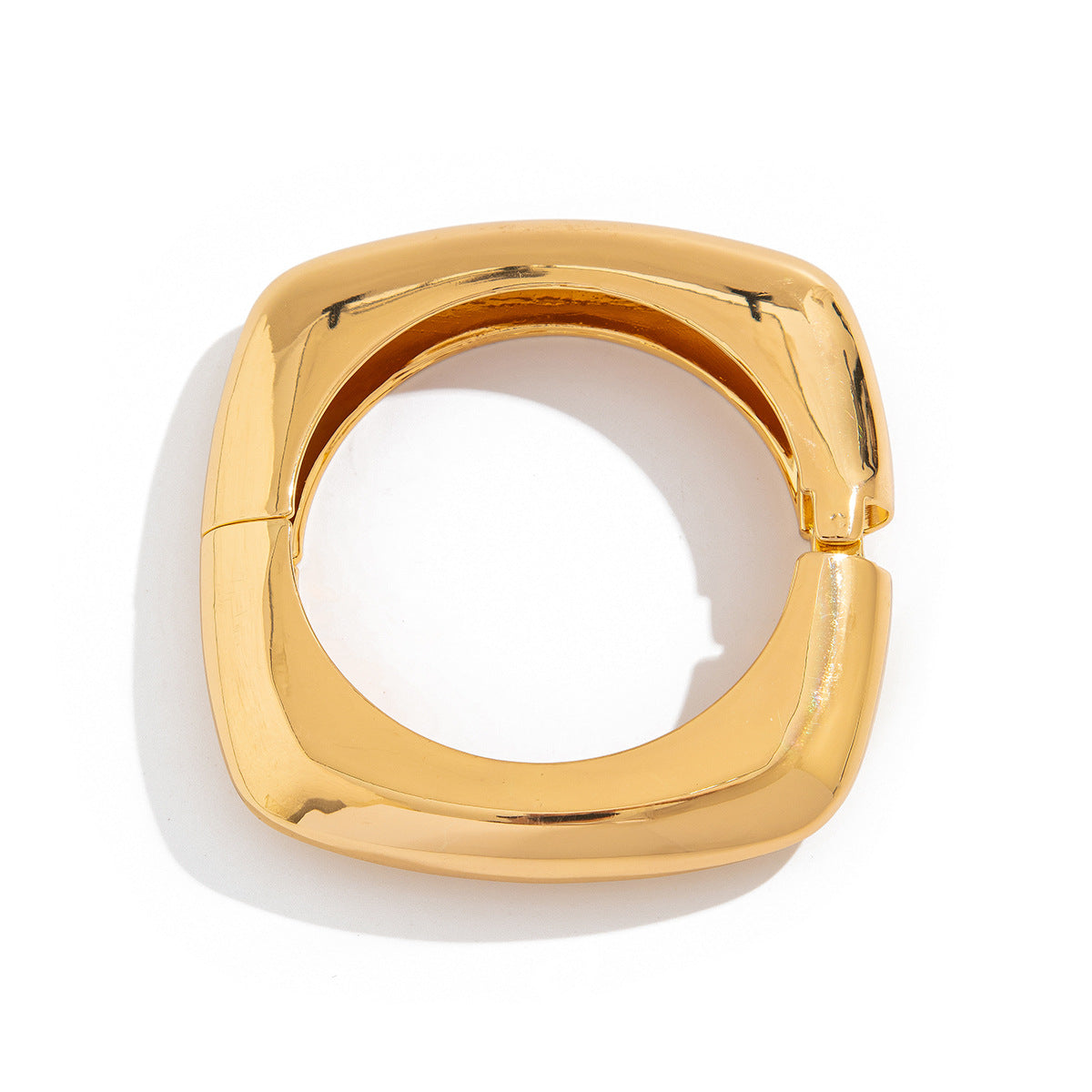 wide sculpted cuff bracelet in high-shine gold – NOVARA