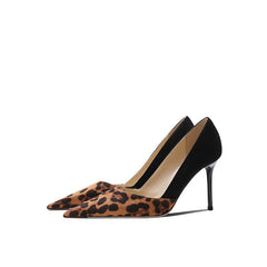 pointed-toe pumps with leopard print and black suede contrast - Solado