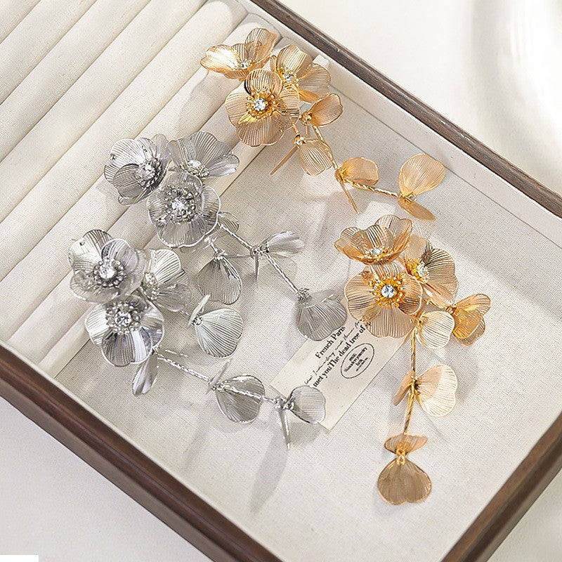 Cascading floral earring with crystal center – Broki