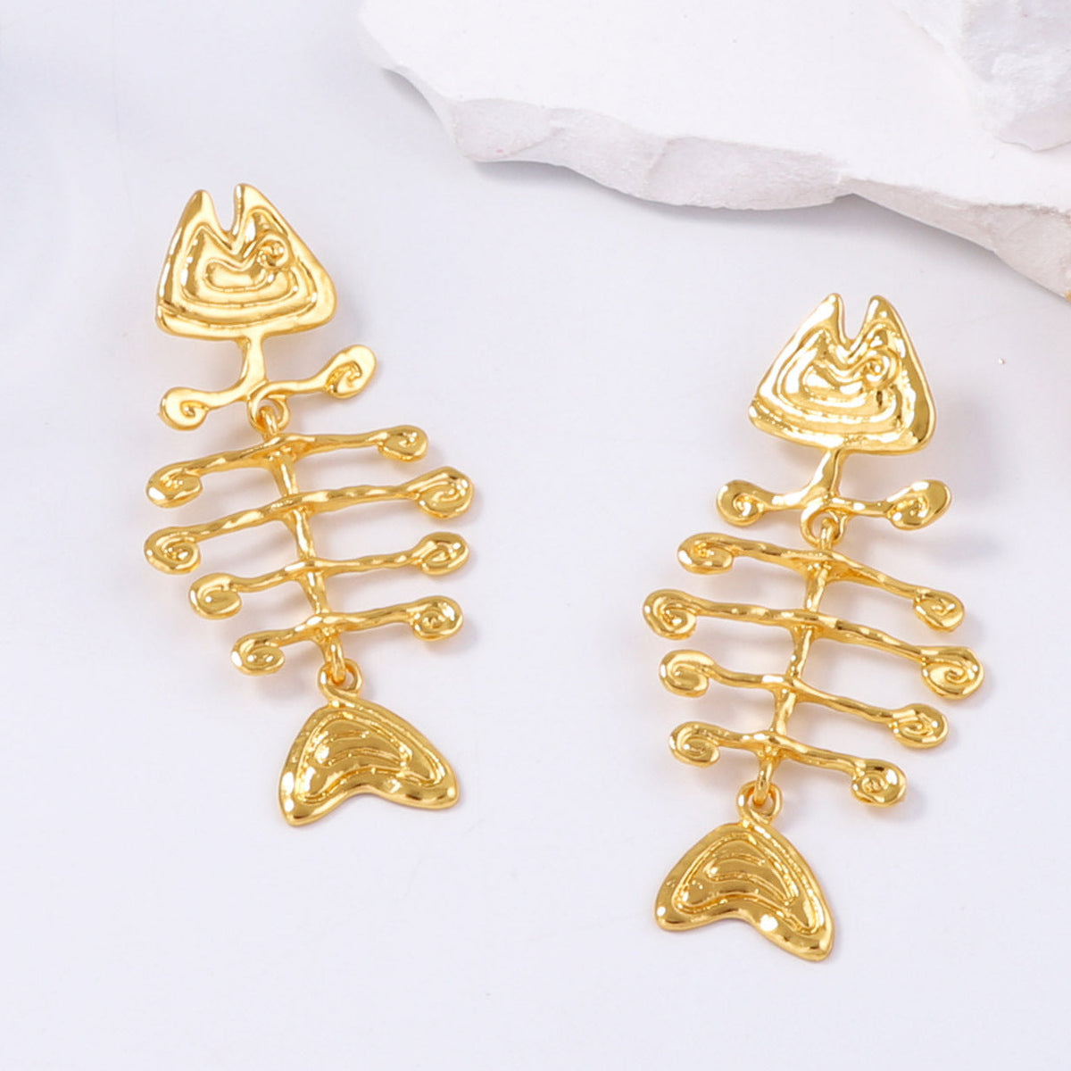 geometric statement earrings with tribal fishbone motif – ORA