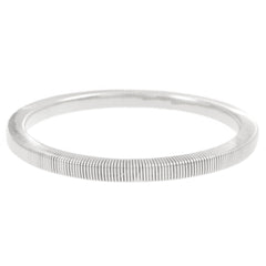 sleek coiled metal bangle with gold finish – ALVINA