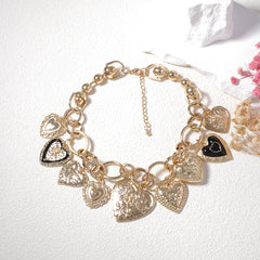 Gold-tone charm necklace with embossed heart pendants - Alginu
