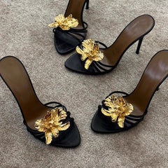 black stiletto mules with gold sculpted flower – CALISTA