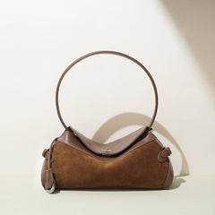 curved suede shoulder bag with flap closure – AURA