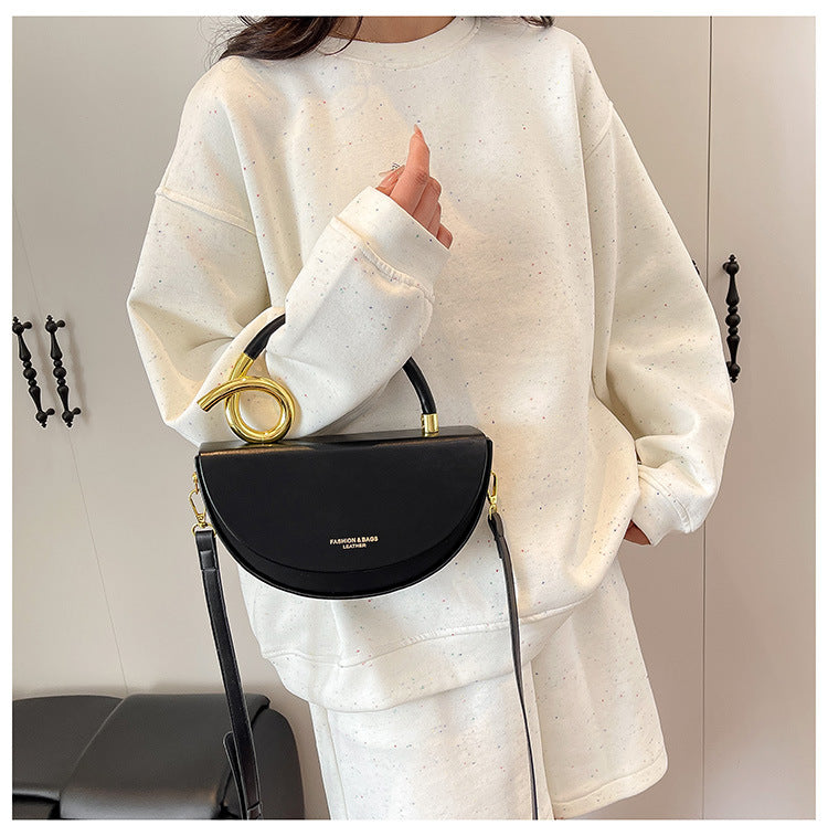 half-moon leather handbag with gold spiral handle – ORENA
