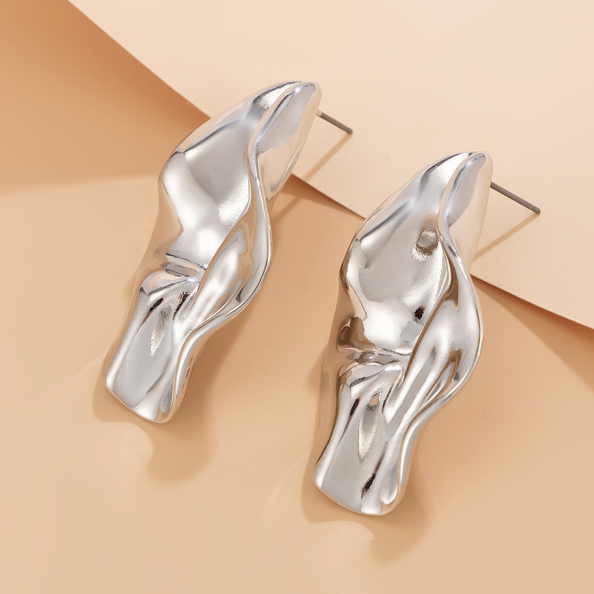 abstract sculpted stud earrings with melted metal finish - Nayam