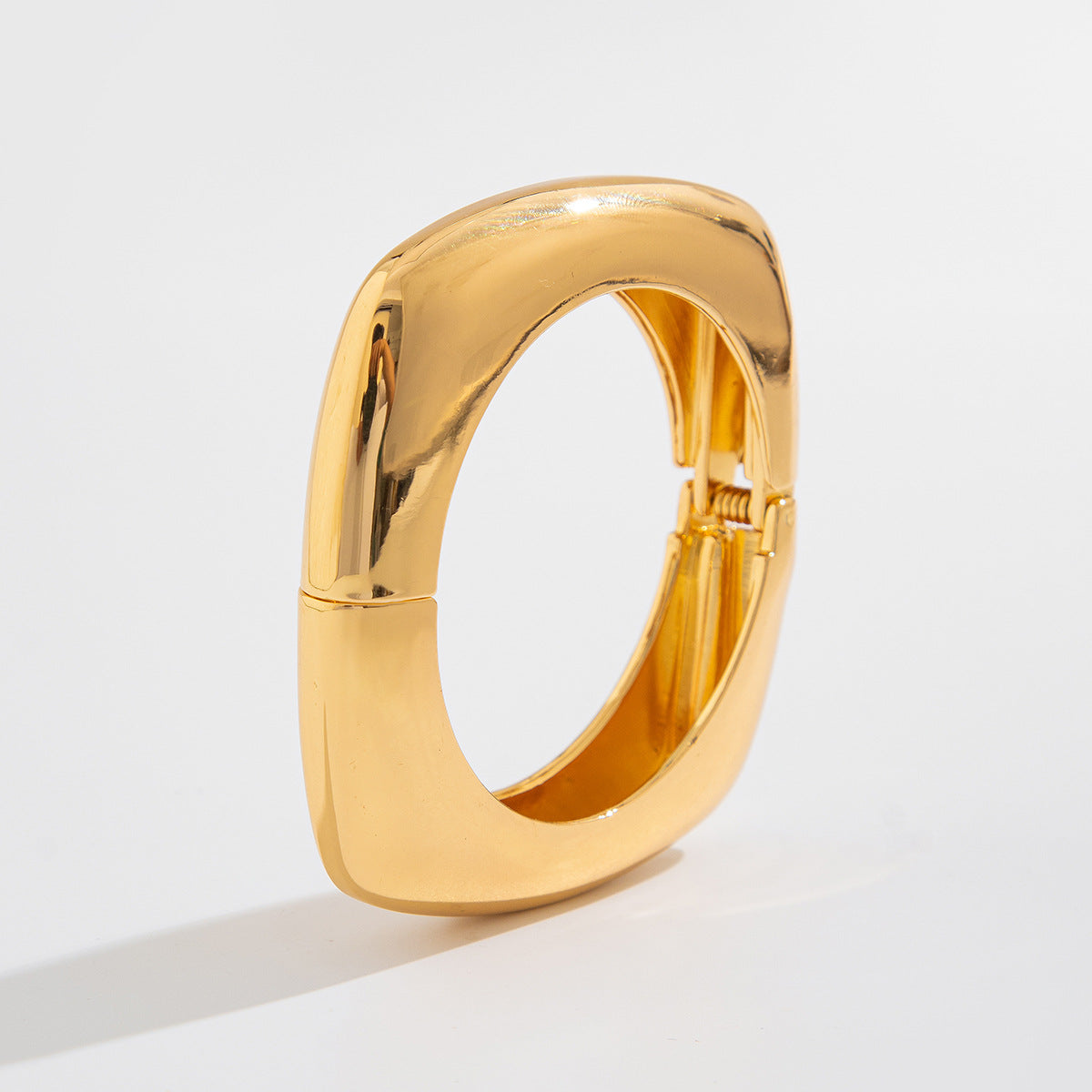 wide sculpted cuff bracelet in high-shine gold – NOVARA