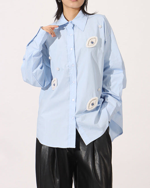 Oversized button-up shirt with embroidered eye patches - Elniru
