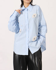 Oversized button-up shirt with embroidered eye patches - Elniru
