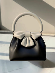 Bow-embellished handbag with round handle - Sikry