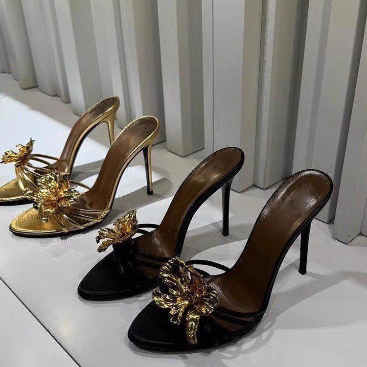black stiletto mules with gold sculpted flower – CALISTA