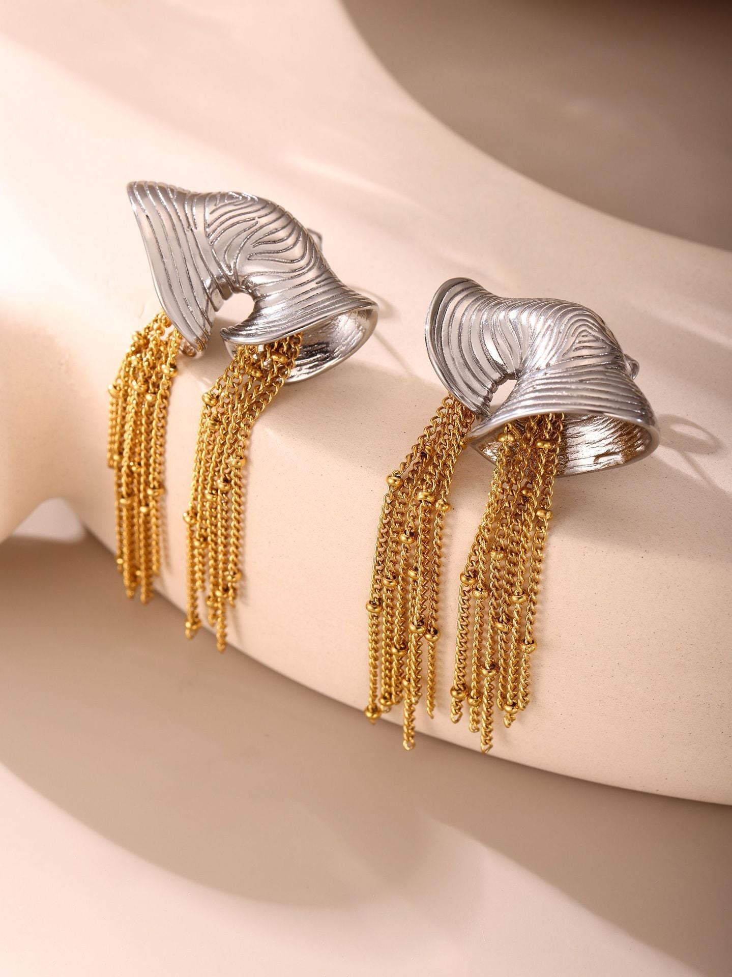 sculpted gold fan earrings with cascading chain tassels – VALINA