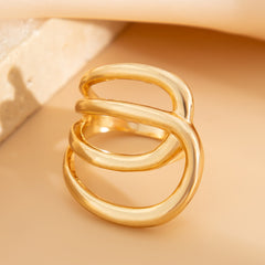 Open triple-loop statement ring with sculptural curve - Nulgi