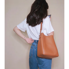 pebbled leather bucket bag with adjustable strap – LUNARD