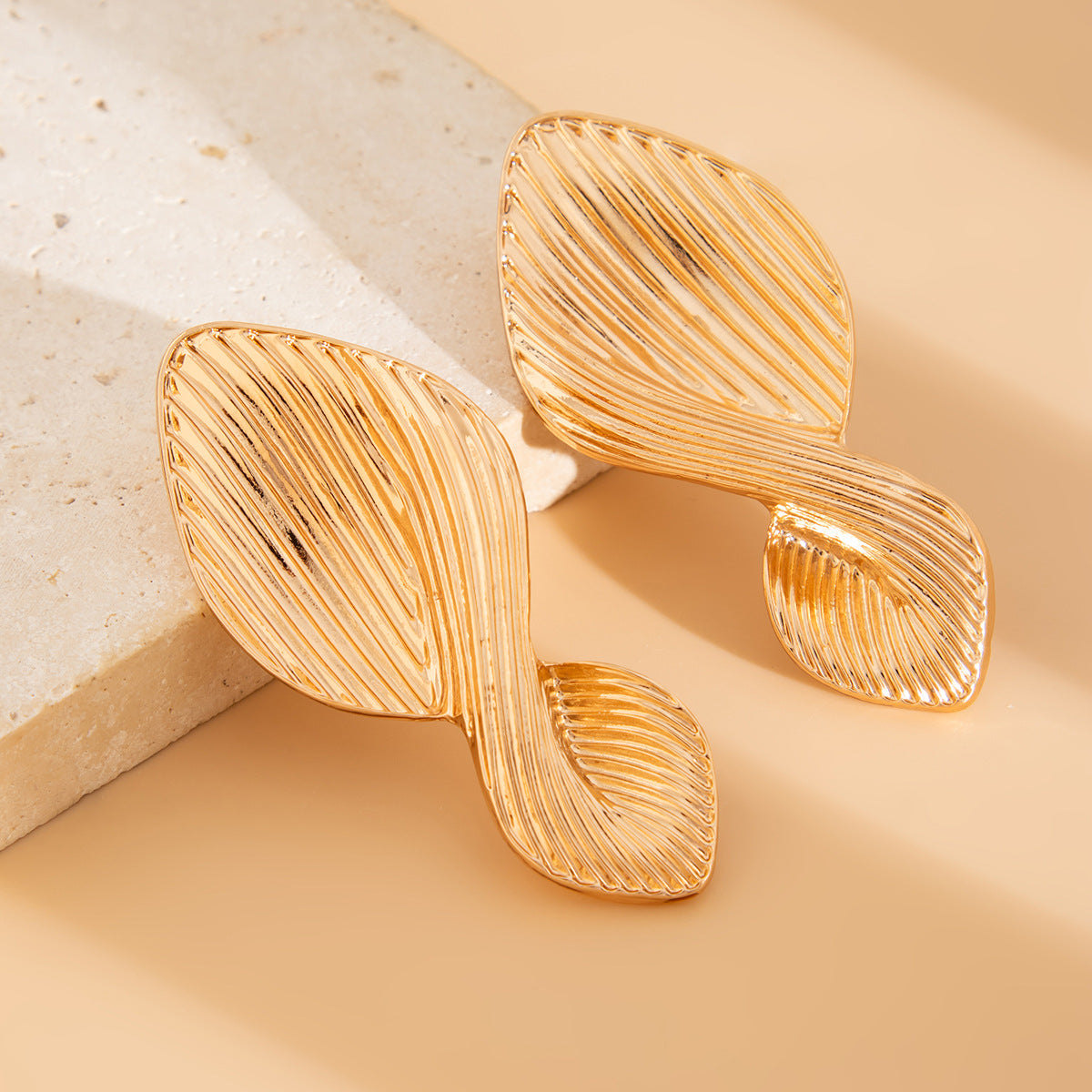 Textured leaf drop earrings with organic twist - Azina