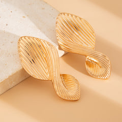 Textured leaf drop earrings with organic twist - Azina