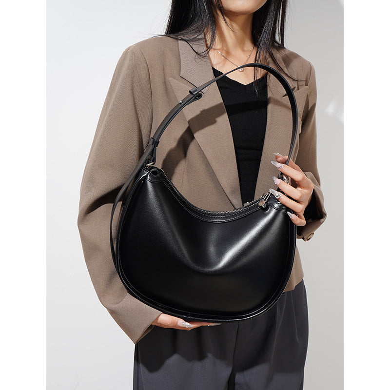 crescent-shaped leather shoulder bag with top zip – OLIVEA