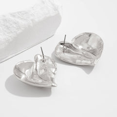Asymmetric heart-shaped stud earrings with sculpted folds – Vancen